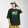 Model wearing the green Lazy Sunset Graphic T-Shirt