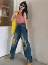 Women Cutting Sleek Heritage Torn Denim
