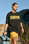 Model wearing the black EVERYONE Oversized T-Shirt
