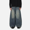 Model wearing the blue Y2K Gravity Denim Jeans