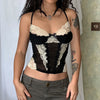 Model wearing the black Lace-Trimmed Ruched Bustier Top