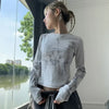 Model wearing the gray Y2K-Inspired Graphic T-Shirt
