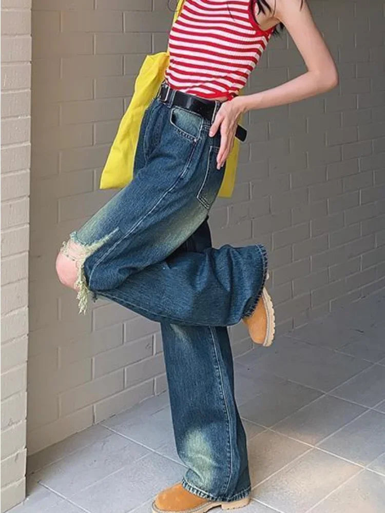 Women Cutting Sleek Heritage Torn Denim
