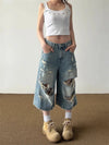 Yıkanmış Yırtık Detaylı Wide Leg Jean Şort, yakın çekim — Navra Wear