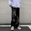 Vintage Wide Leg Örümcek Baskılı Pantolon, yakın çekim — Navra Wear