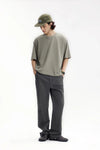 Model wearing the dark gray Men's Straight-Leg Chino Pants