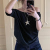 Model wearing the black Relaxed Off-Shoulder T-Shirt 