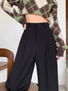 Model wearing the black High-Waisted Wide-Leg Pants