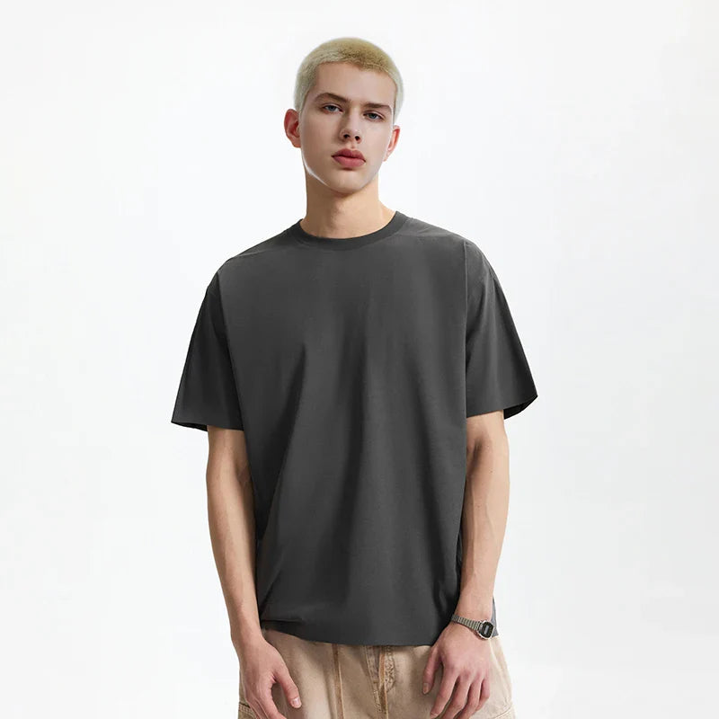 Model wearing the dark gray Y2K Essential T-Shirt