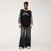 Model wearing the black Flared Wide-Leg Denim Jeans