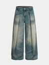 Yıkanmış Taşlamalı Buruşuk Jean Pantolon, yan görünüm — Navra Wear